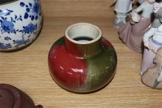 A Chinese squat baluster vase, crackle-glazed in green and red, a blue and white ginger jar and cover and a redware teapot